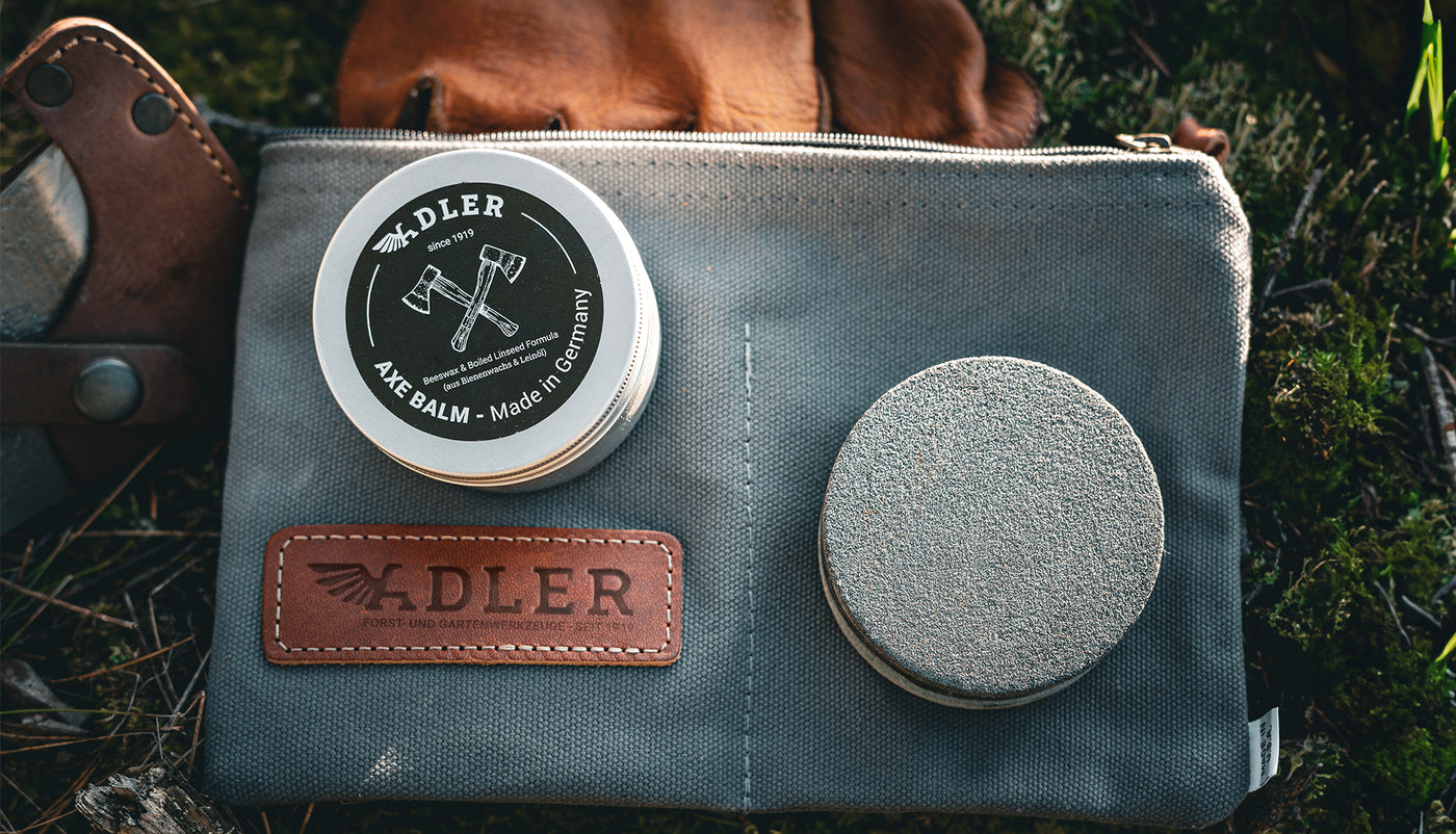 adler axe care set laid out on the forest floor